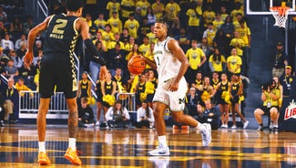 Next Story Image: Last Night in College Basketball: Michigan Dominated (Even With The Lights Off)
